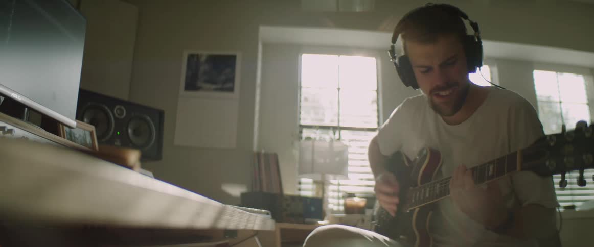 A musician plays his guitar