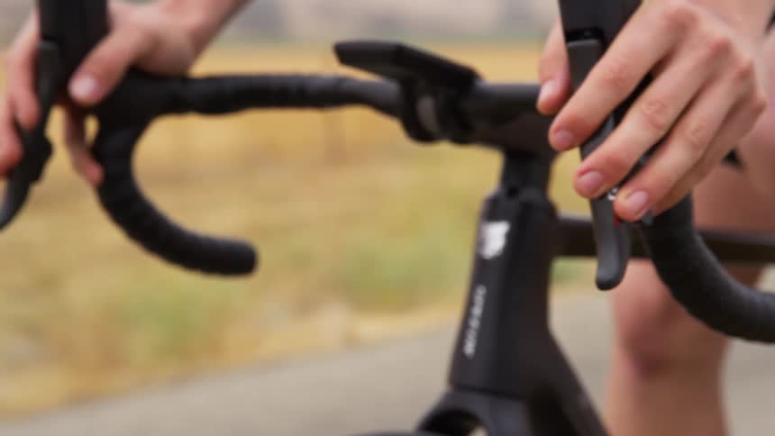A man is riding a bicycle outdoors