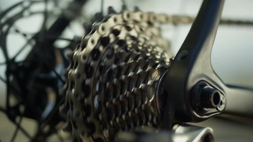Bicycle chains move in unison as a rider pedals