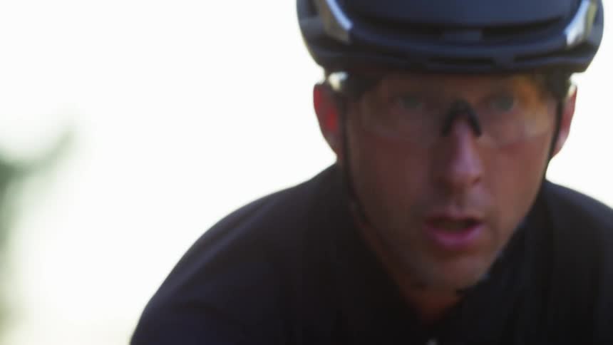 Man wearing a helmet does some exercise outdoors