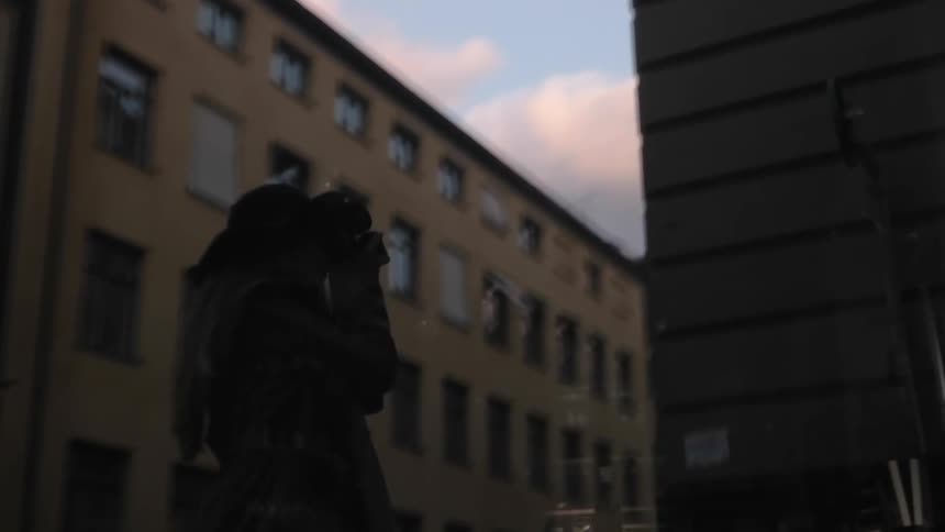 Reflection of a photographer in the city