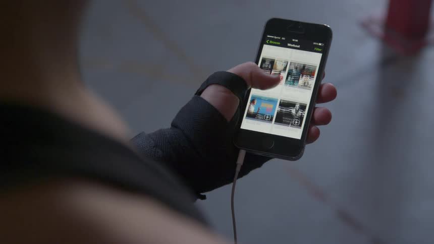 A person is flipping through their cell phone