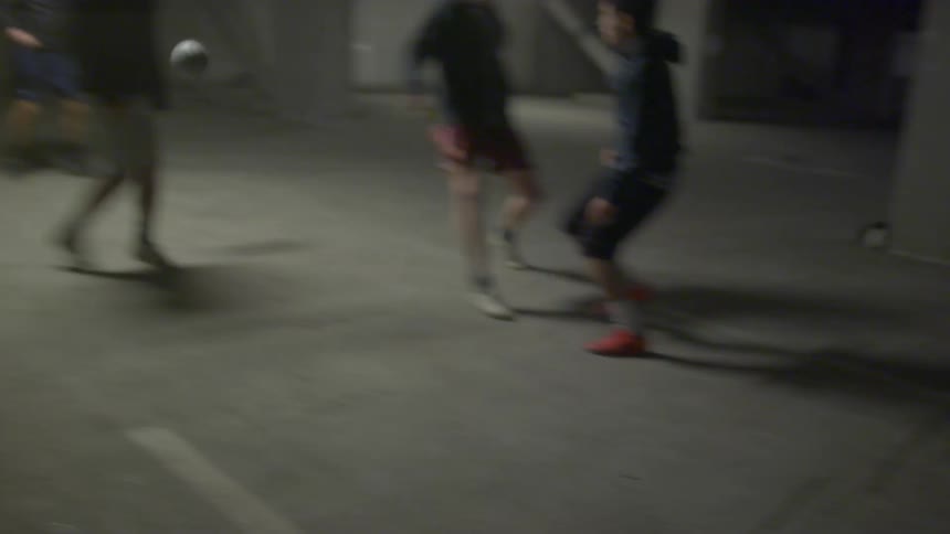 A group of men are playing soccer