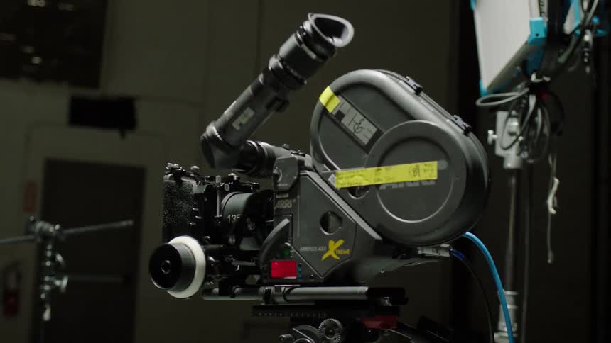 A motion picture camera in a room