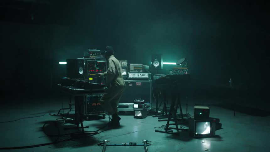 A man is in a music studio