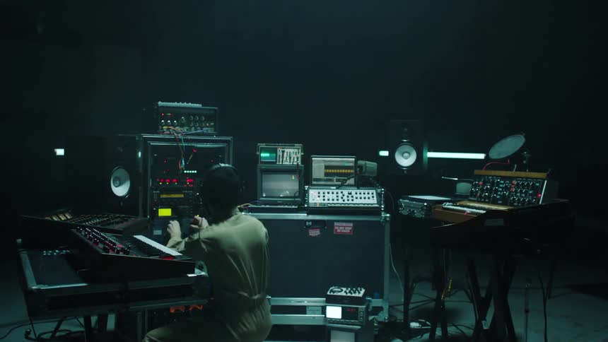 A man is in a music studio