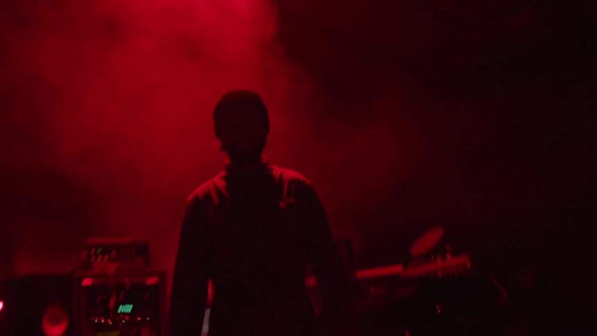 A man is playing music indoors