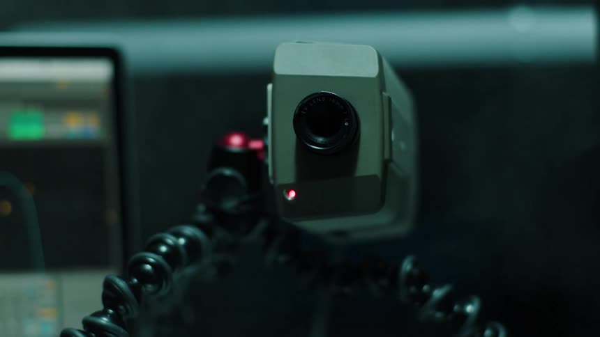 The camera on the tripod is recording