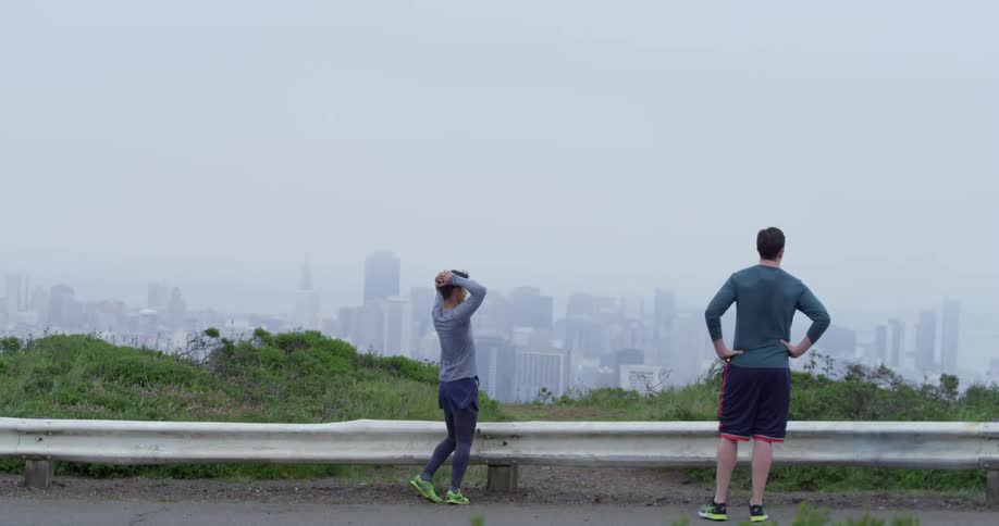A father and son look across at a city skyline