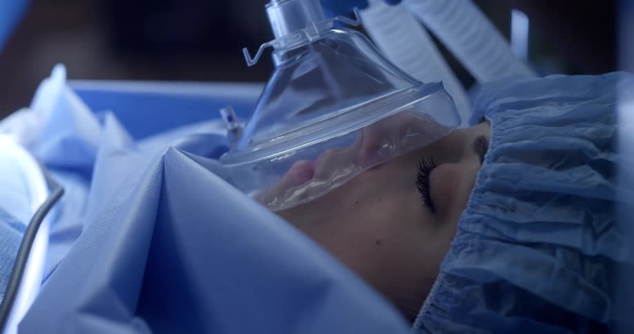 A patient sleeps due to anesthesia during surgery