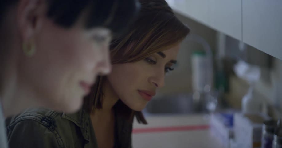Woman and patient talk to each other in a clinic