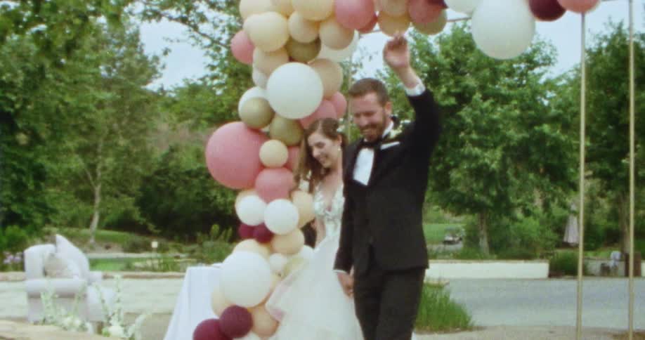 Walking into wedding reception as a newly married couple