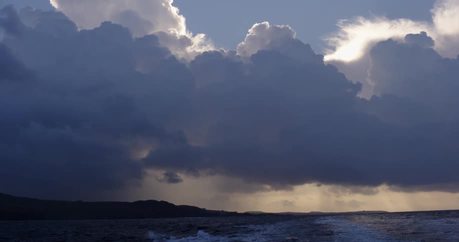 The storm clouds are raining in the distance
