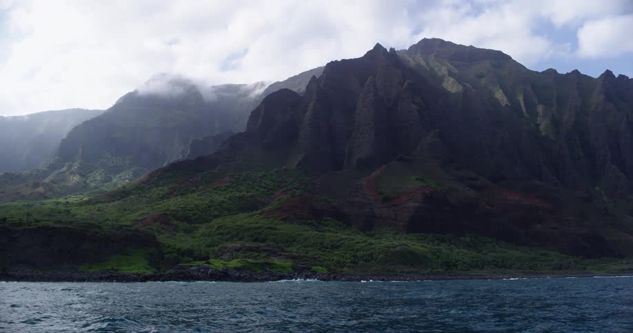 A large body of water at the base of a mountain
