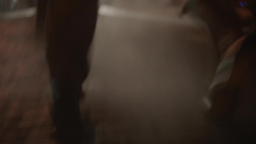 Tight shot of people's feet as the run down a cobblestone street