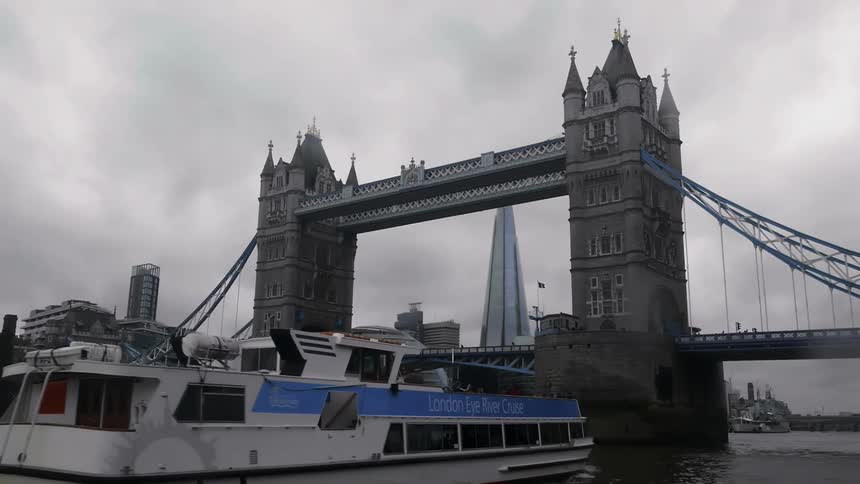 Ferry boat driving towards the London Bridge