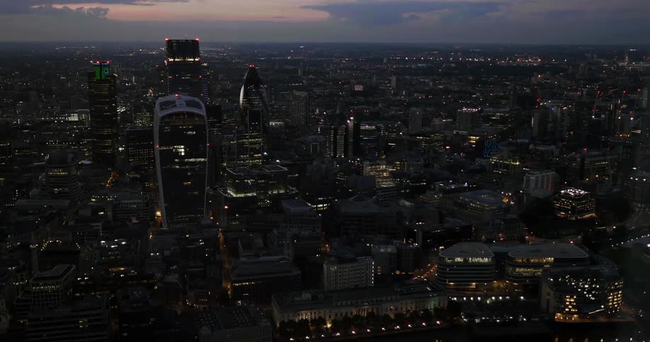 Aerial view of a city and London Egg as the sun sets