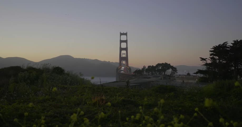 View of a bridge in the distance as the sun sets