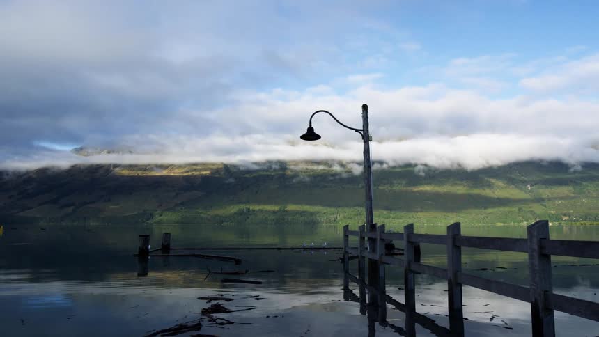 Sunken boardwalk in a lake near the mountains