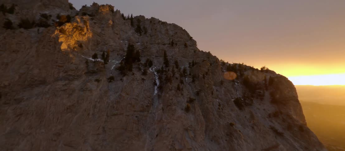 A mountain is displayed at sunset