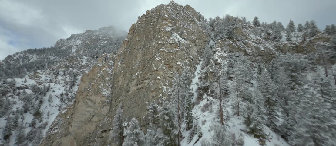 Aerial view of snow covered mountain range peaks
