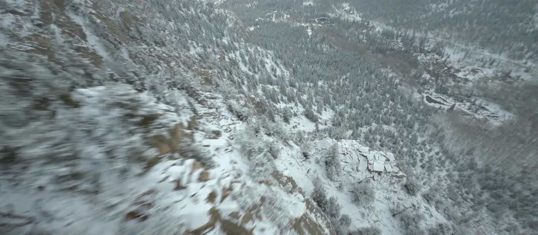 The side of the mountain is covered with snow and ice