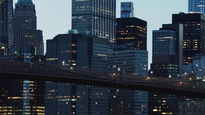 Cars driving across a bridge in a city