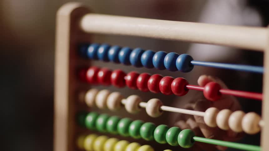 A child counts on an abacus