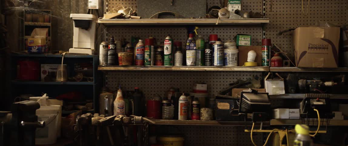 The shelves are filled with cans and sprays