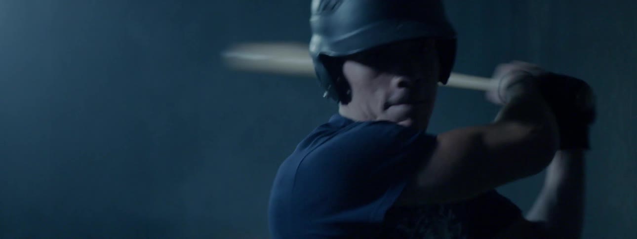 A man is playing baseball outdoors