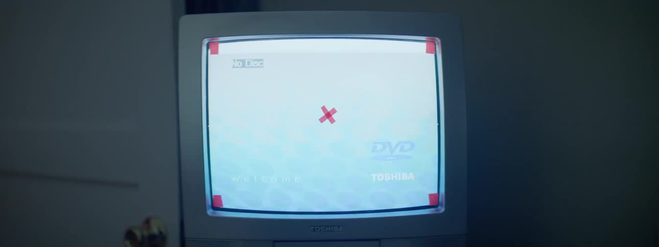 A television screen is displayed at night