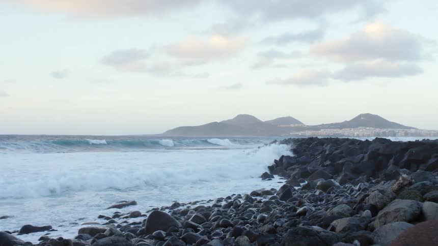 Waves crashing on a rocky shoreline on the coast