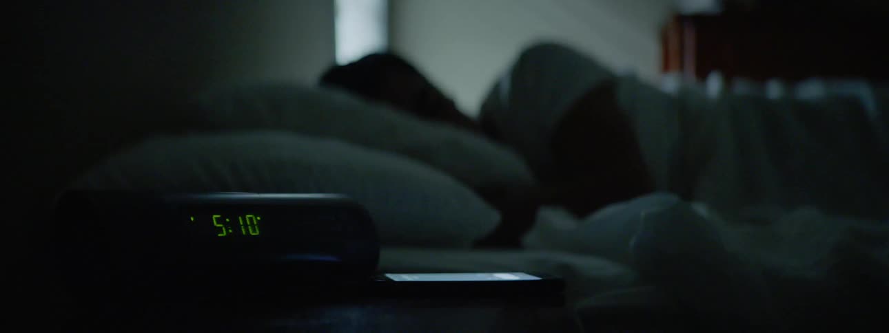A person is sleeping in a bedroom