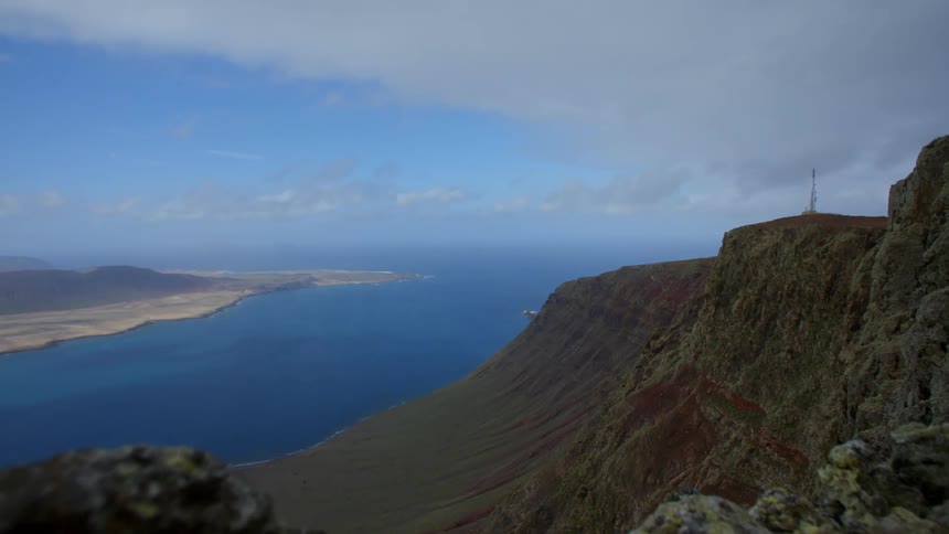 Mountains surrounding a river meeting the ocean