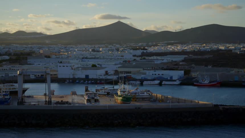 Boats and ships stored both on and off the water at a small port