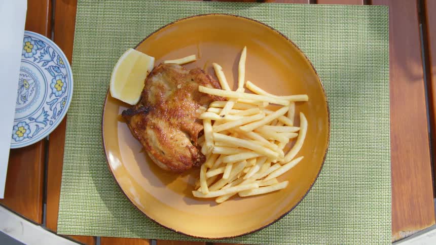 Food sitting on a plate outside