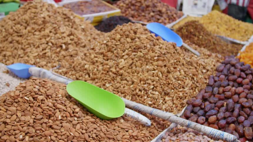 Boxes full of grain and fruits in an open air market