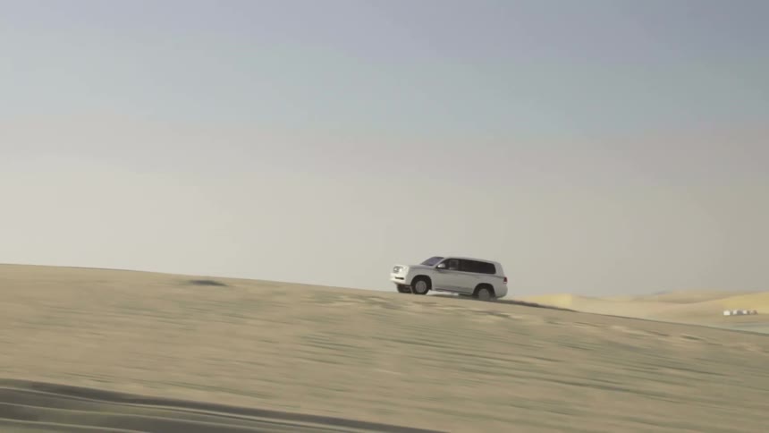 A sport utility vehicle drives through