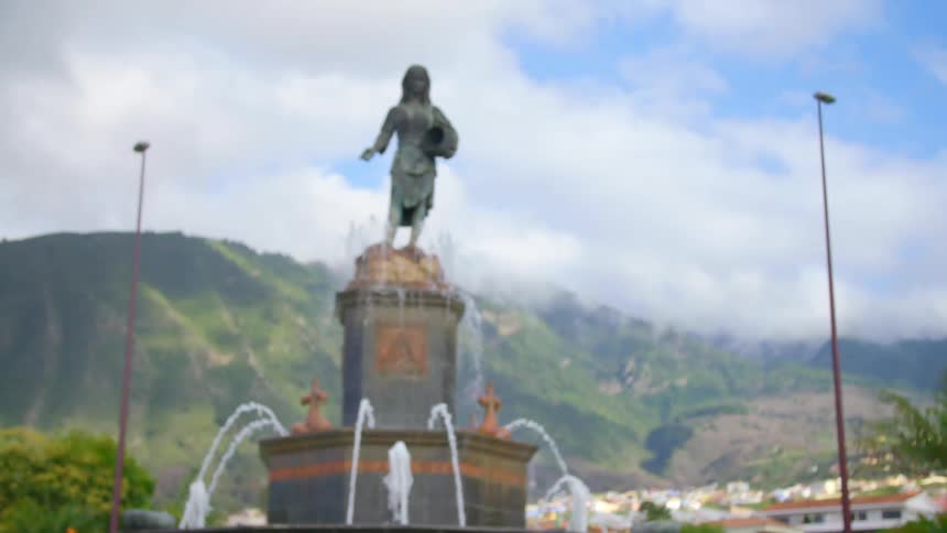 A statue and fountain outdoors