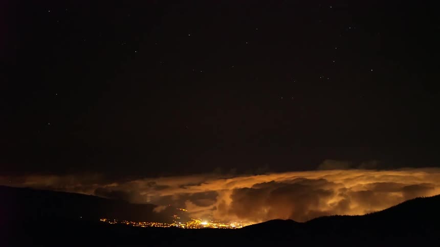 Aerial view of storm clouds over a skyline