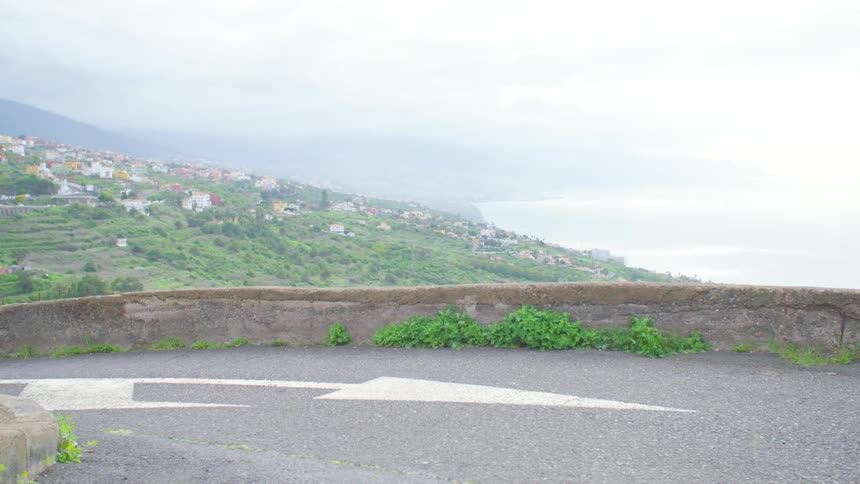 A road with the landscape behind it