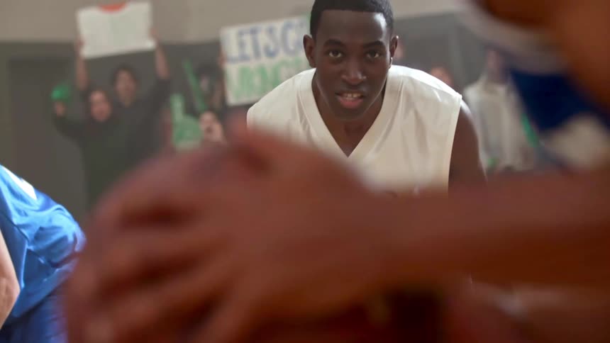 Opponent jeers as a man takes a free throw shot