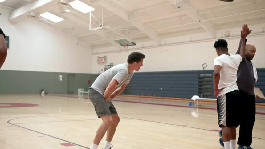 Players greet on the basketball court