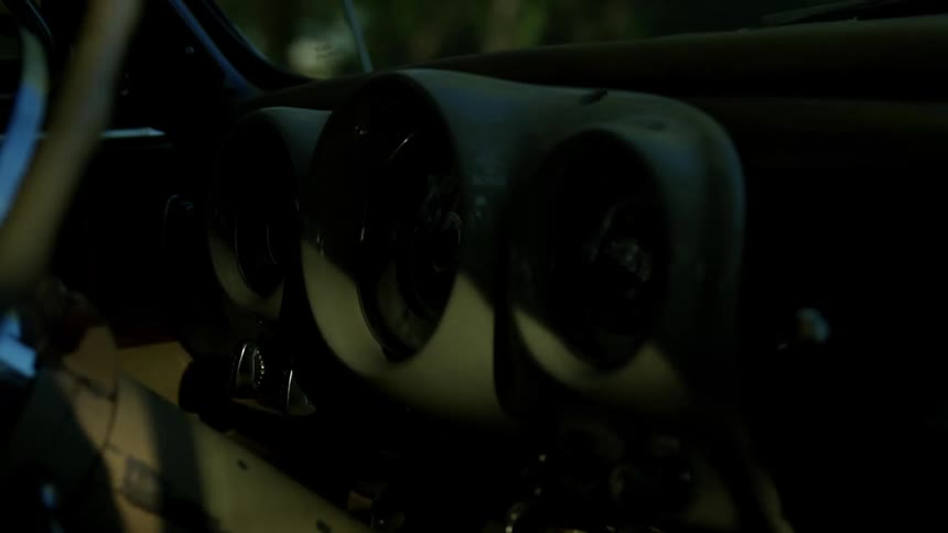 Dashboard of a vintage car while driving