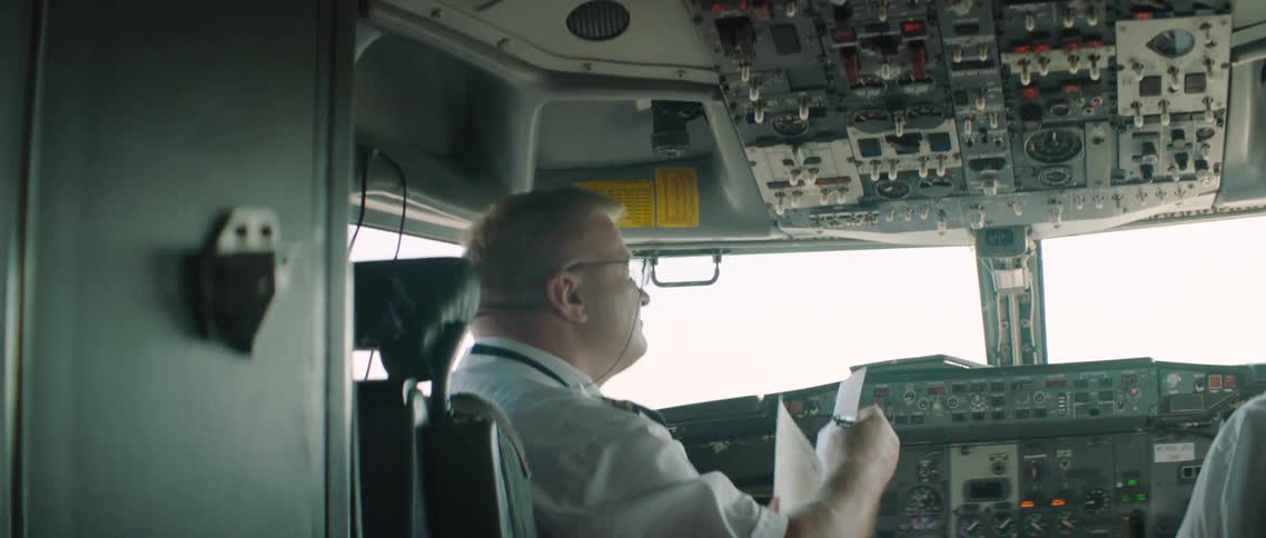 A pilot and co pilot in the cockpit
