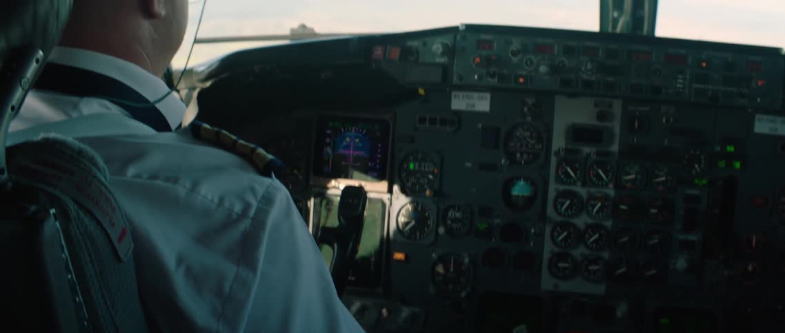 A man is flying an airplane