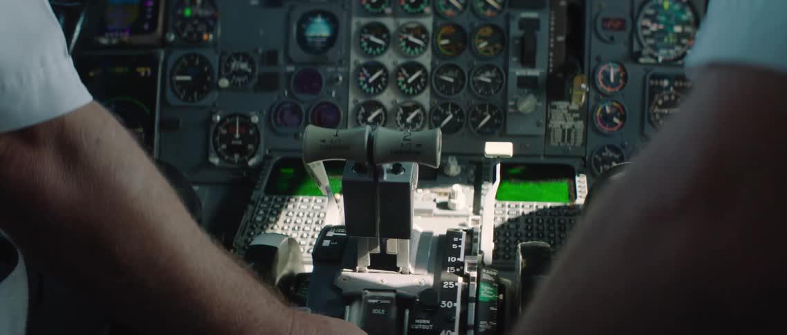 Two men in a cockpit of an airplane
