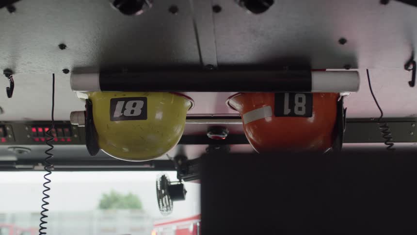 Helmets hang in the fire truck