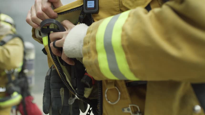 Firefighters gear up to put out a fire