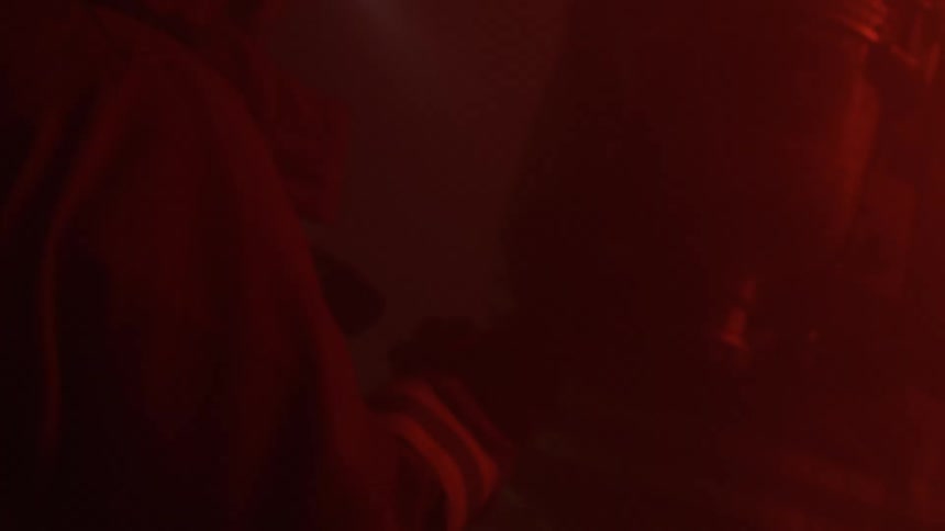 Firefighters search in a smoke filled room